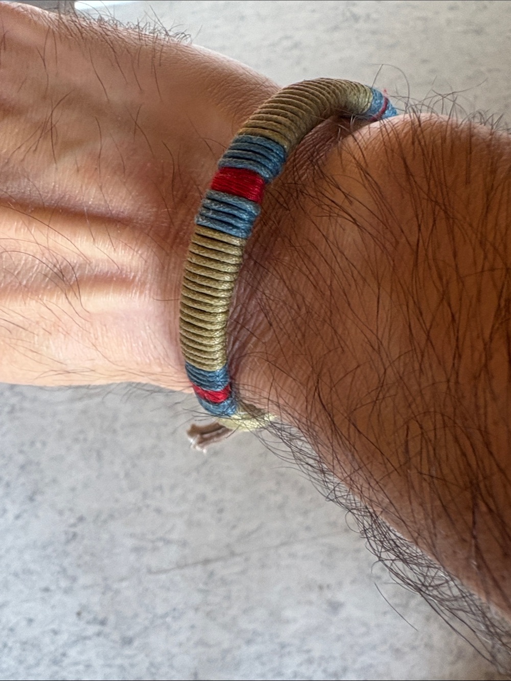 Native breaded canvas bracelet. Olive green with red and blue strips.